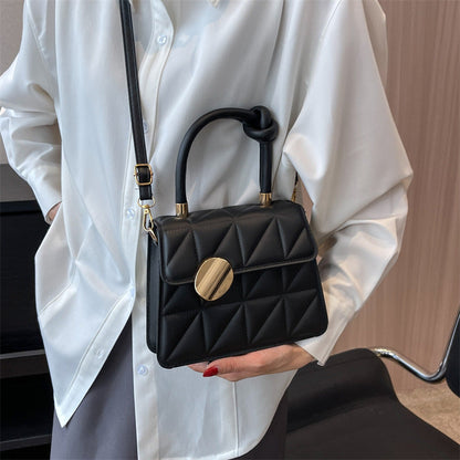 Petit sac à main au design géométrique